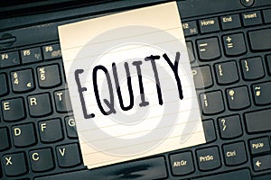 Writing note showing Equity. Business photo showcasing quality of being fair and impartial race free One hand Unity