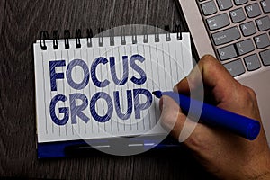 Writing note showing Focus Group. Business photo showcasing people assembled to participate in discussion about something Man hold