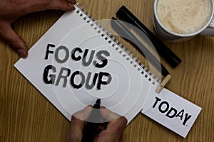 Writing note showing Focus Group. Business photo showcasing people assembled to participate in discussion about something Man hold