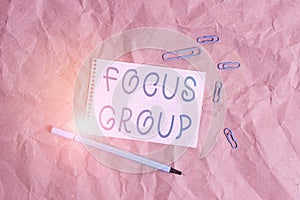 Writing note showing Focus Group. Business photo showcasing showing assembled to participate in discussion about something