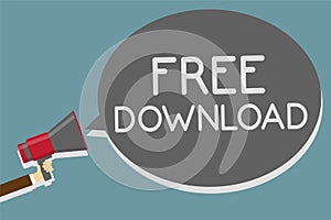 Writing note showing Free Download. Business photo showcasing Key in Transfigure Initialize Freebies Wireless Images Man holding m photo