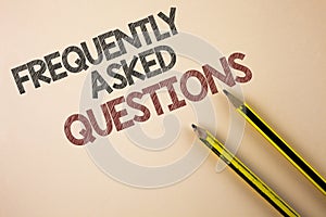 Writing note showing Frequently Asked Questions. Business photo showcasing most common inquiries Informations Help Guide written photo