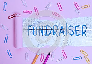 Writing note showing Fundraiser. Business photo showcasing demonstrating whose job or task is seek financial support for photo