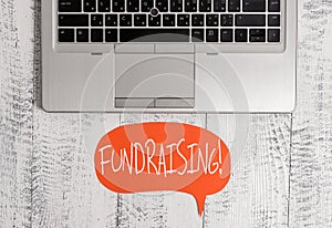 Writing note showing Fundraising. Business photo showcasing seeking to generate financial support for charity or cause