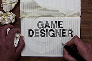 Writing note showing Game Designer. Business photo showcasing Campaigner Pixel Scripting Programmers Consoles 3D Graphics Man hold
