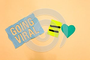 Writing note showing Going Viral. Business photo showcasing image video or link that spreads rapidly through population Blue paper