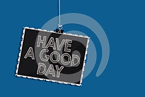 Writing note showing Have A Good Day. Business photo showcasing Nice gesture positive wishes Greeting Enjoy Be happy Hanging black