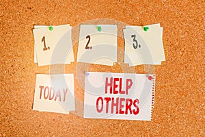 Writing note showing Help Others. Business photo showcasing the action of helping someone to do something or assistance Corkboard