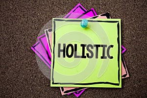 Writing note showing Holistic. Business photo showcasing Belief the parts of something are interconnected Related to holism Paper photo
