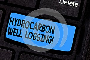 Writing note showing Hydrocarbon Well Logging. Business photo showcasing record of the geologic formations of a borehole Keyboard