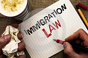 Writing note showing Immigration Law. Business photo showcasing National Regulations for immigrants Deportation rules written by