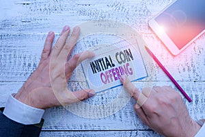 Writing note showing Initial Coin Offering. Business photo showcasing crowdfunding using cryptocurrencies raising