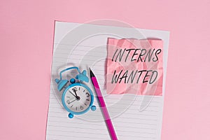 Writing note showing Interns Wanted. Business photo showcasing Looking for on the job trainee Part time Working student