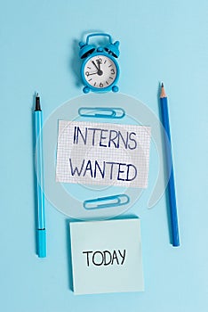 Writing note showing Interns Wanted. Business photo showcasing Looking for on the job trainee Part time Working student