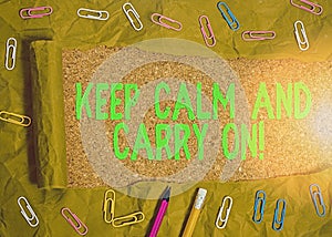 Writing note showing Keep Calm And Carry On. Business photo showcasing slogan calling for persistence face of challenge