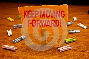 Writing note showing Keep Moving Forward Motivational Call. Business photo showcasing Optimism Progress Persevere Move Paperclip