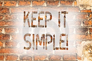 Writing note showing Keep It Simple. Business photo showcasing Simplify Things Easy Understandable Clear Concise Ideas Brick Wall