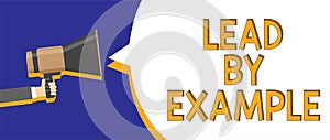 Writing note showing Lead By Example. Business photo showcasing Be a mentor leader follow the rules give examples Coach Man holdin