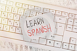 Writing note showing Learn Spanish. Business photo showcasing Translation Language in Spain Vocabulary Dialect Speech Keyboard