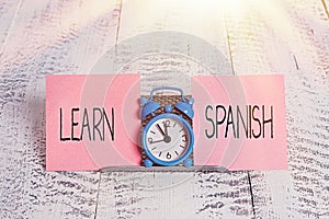 Writing note showing Learn Spanish. Business photo showcasing Translation Language in Spain Vocabulary Dialect Speech Mini blue