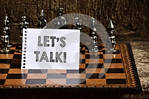 Writing note showing Let S Is Talk. Business photo showcasing suggesting in the beginning of a conversation on the topic