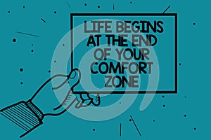 Writing note showing Life Begins At The End Of Your Comfort Zone. Business photo showcasing Make changes evolve grow Man hand hold