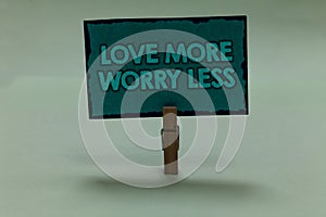 Writing note showing Love More Worry Less. Business photo showcasing Have a good attitude motivation be lovable enjoy