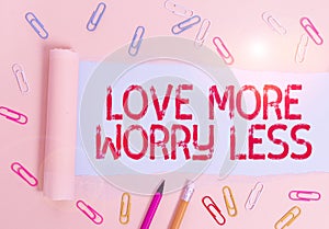 Writing note showing Love More Worry Less. Business photo showcasing Have a good attitude motivation be lovable enjoy