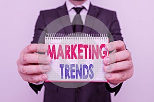 Writing note showing Marketing Trends. Business photo showcasing changes and developments in trading in the market Male