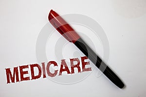 Writing note showing Medicare. Business photo showcasing Federal health insurance for people above 65 or with disabilities Softlin