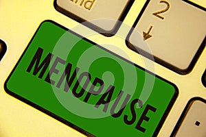 Writing note showing Menopause. Business photo showcasing Period of permanent cessation or end of menstruation cycle Keyboard gree