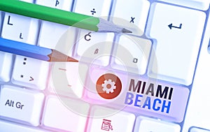 Writing note showing Miami Beach. Business photo showcasing the coastal resort city in MiamiDade County of Florida.