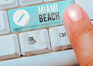 Writing note showing Miami Beach. Business photo showcasing the coastal resort city in MiamiDade County of Florida photo