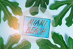Writing note showing Miami Beach. Business photo showcasing the coastal resort city in MiamiDade County of Florida photo