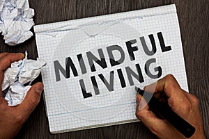 Writing note showing Mindful Living. Business photo showcasing Fully aware and engaged on something Conscious and Sensible Man hol