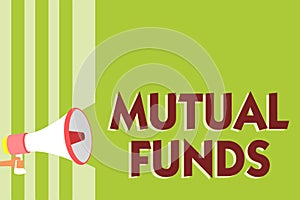 Writing note showing Mutual Funds. Business photo showcasing An investment program funded by shareholders Individual Stocks Megaph