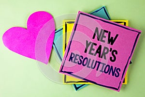 Writing note showing New Year'S Resolutions. Business photo showcasing Goals Objectives Targets Decisions for next 365 days writ