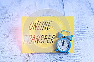 Writing note showing Online Transfer. Business photo showcasing authorizes a fund transfer over an electronic funds transfer Alarm photo