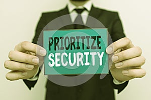 Writing note showing Prioritize Security. Business photo showcasing designate security risk as more important to solve