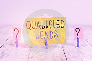 Writing note showing Qualified Leads. Business photo showcasing lead judged likely to become a customer compared to other