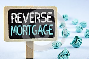 Writing note showing Reverse Mortgage. Business photo showcasing Elderly homeowner retirement option regular payment benefit writ