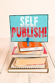 Writing note showing Self Publish. Business photo showcasing writer publish piece of ones work independently at own expense pile