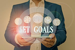 Writing note showing Set Goals. Business photo showcasing Defining or achieving something in the future based on plan