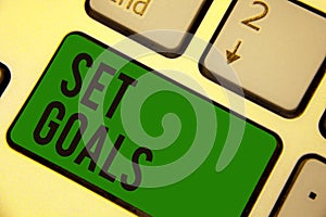 Writing note showing Set Goals. Business photo showcasing Defining or achieving something in the future based on plan Keyboard gre