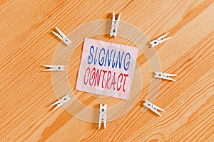 Writing note showing Signing Contract. Business photo showcasing the parties signing the document agree to the terms