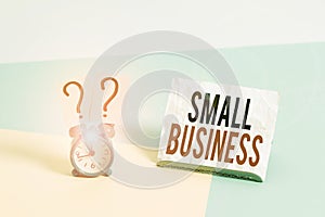 Writing note showing Small Business. Business photo showcasing privately owned corporations that has less employees Alarm clock