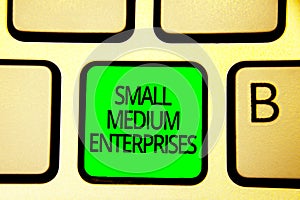 Writing note showing Small Medium Enterprises. Business photo showcasing companies with less than thousand workers Keyboard green
