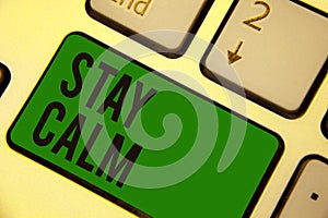 Writing note showing Stay Calm. Business photo showcasing Maintain in a state of motion smoothly even under pressure Keyboard gree