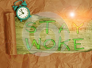 Writing note showing Stay Woke. Business photo showcasing being aware of your surroundings and things going on Keep