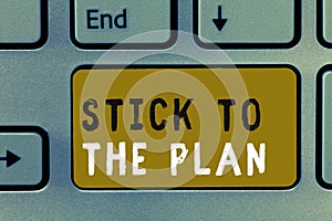 Writing note showing Stick To The Plan. Business photo showcasing To adhere to some plan and not deviate from it Follow